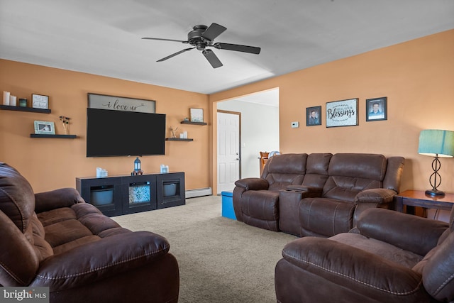 carpeted living room featuring a baseboard heating unit and ceiling fan