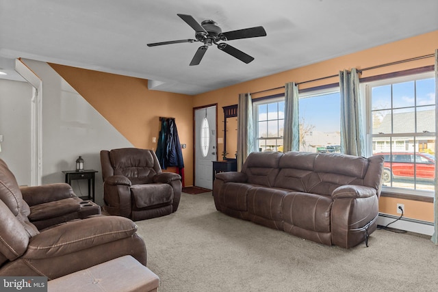 carpeted living room with plenty of natural light, ceiling fan, and a baseboard radiator