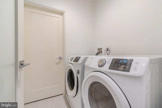 laundry area featuring laundry area and washer and clothes dryer