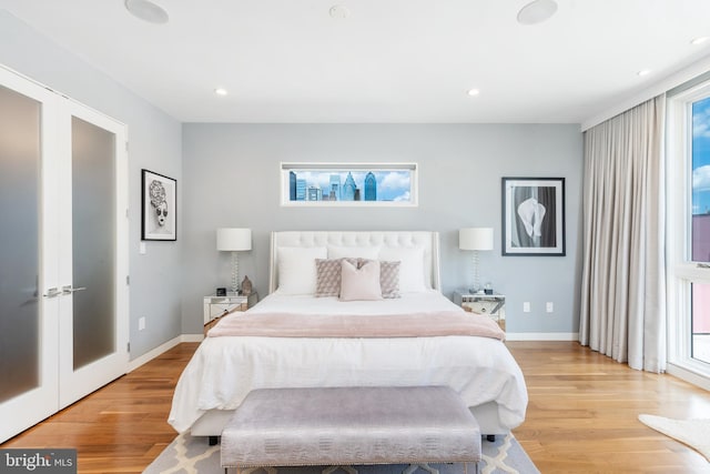 bedroom featuring light wood-style floors, baseboards, and recessed lighting