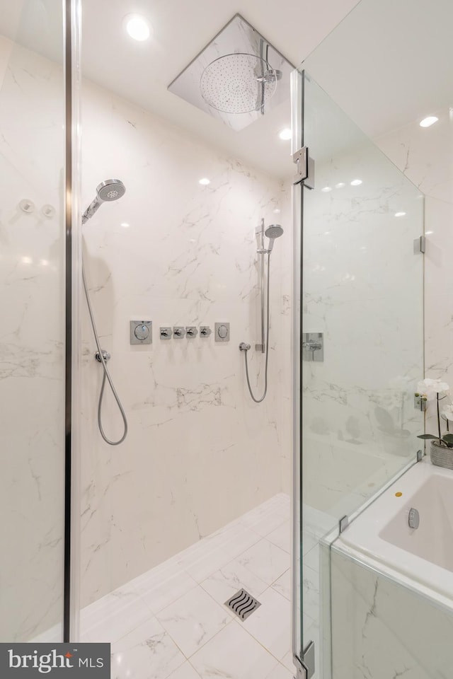 full bathroom featuring marble finish floor, a marble finish shower, a bath, and recessed lighting