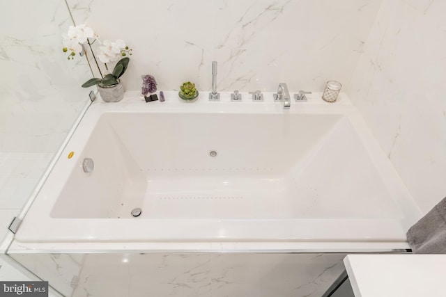 bathroom with a jetted tub