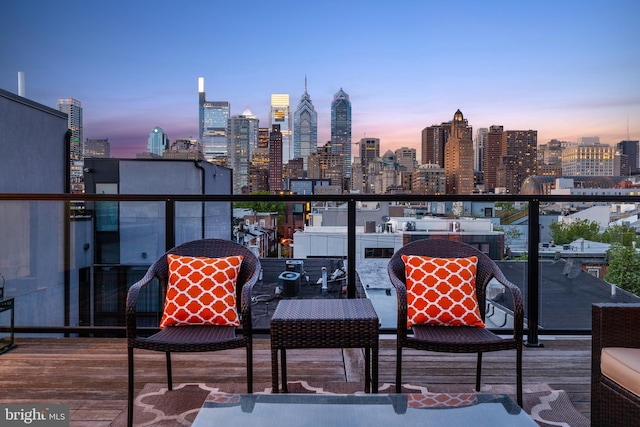 balcony at dusk with a city view