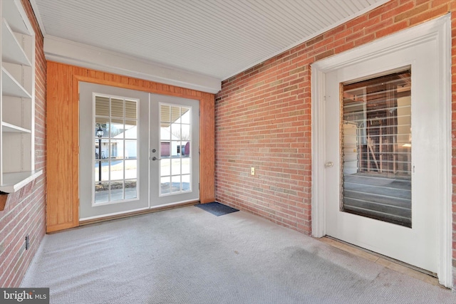 unfurnished sunroom featuring french doors