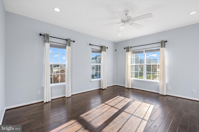 empty room with a ceiling fan, wood finished floors, baseboards, visible vents, and recessed lighting