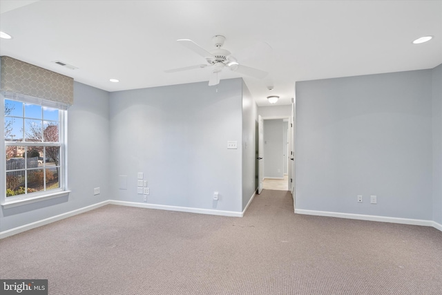 empty room featuring baseboards, carpet flooring, visible vents, and recessed lighting