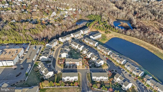 aerial view with a residential view and a water view