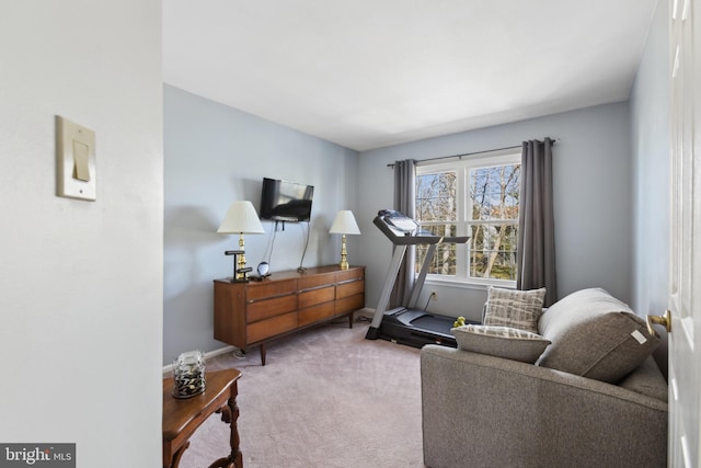 interior space featuring carpet flooring and baseboards