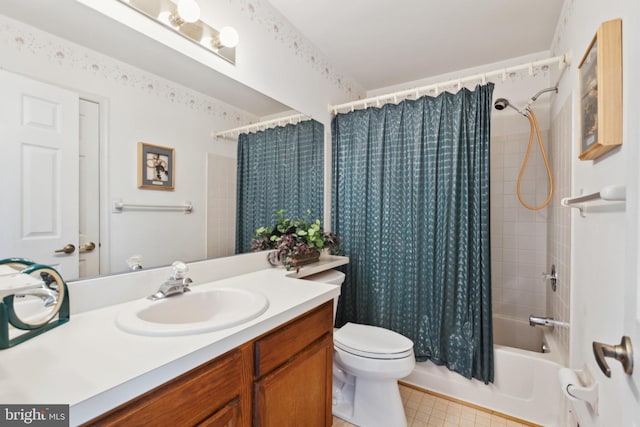 bathroom featuring toilet, shower / tub combo, and vanity