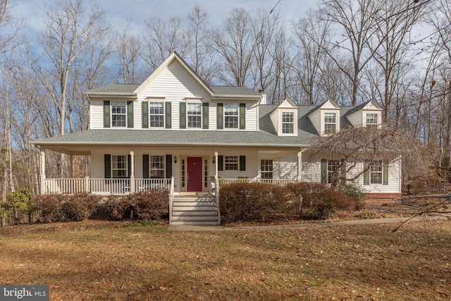 view of front facade with a porch and a shingled roof