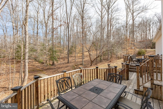 deck featuring outdoor dining area