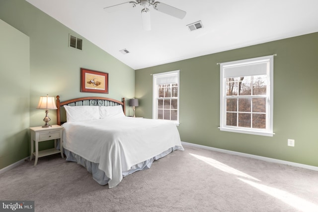 bedroom featuring visible vents, baseboards, carpet floors, and vaulted ceiling