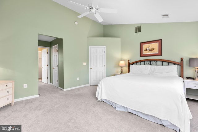 carpeted bedroom featuring visible vents, baseboards, high vaulted ceiling, and ceiling fan