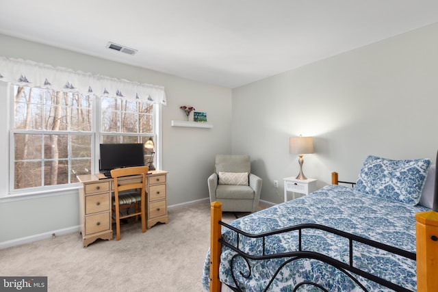 bedroom with visible vents, carpet flooring, and baseboards