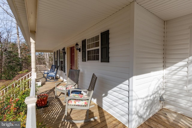 wooden deck featuring covered porch