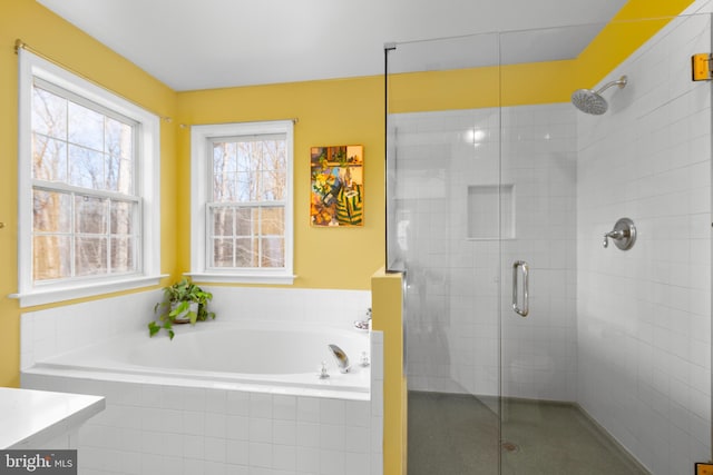 full bathroom with a garden tub, a stall shower, and vanity