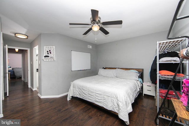 bedroom featuring wood finished floors, a ceiling fan, and baseboards