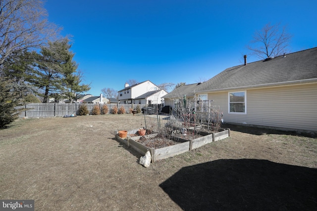 view of yard featuring a garden and fence