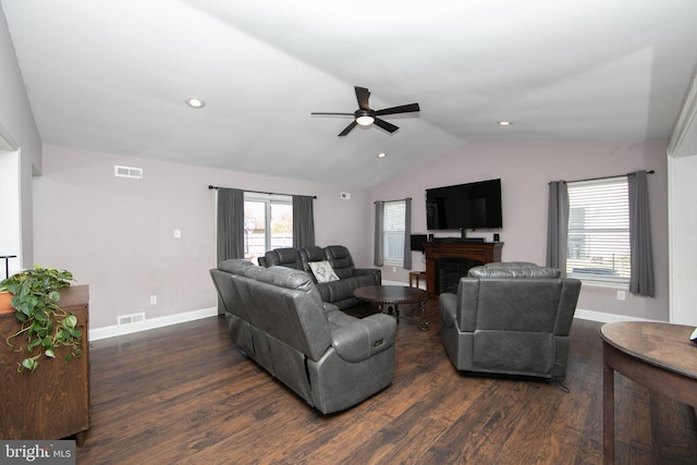 living room featuring baseboards, lofted ceiling, wood finished floors, a fireplace, and recessed lighting