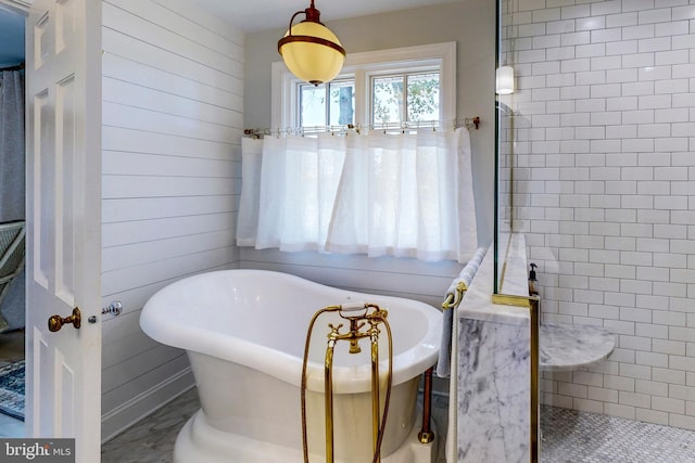 full bath featuring a tile shower, wooden walls, and a freestanding bath