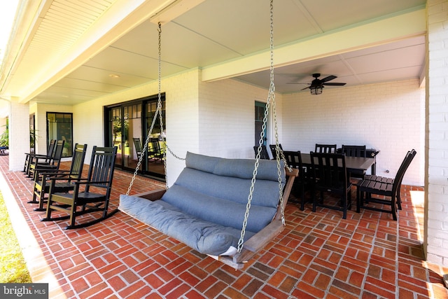 view of patio with outdoor dining space and ceiling fan