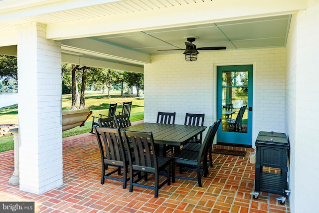 view of patio / terrace with outdoor dining area and a ceiling fan