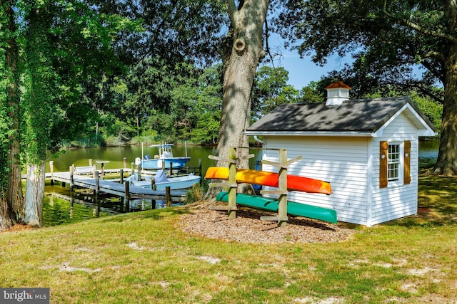 exterior space with a water view and a yard