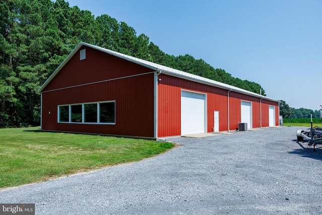 view of outdoor structure featuring an outbuilding and cooling unit