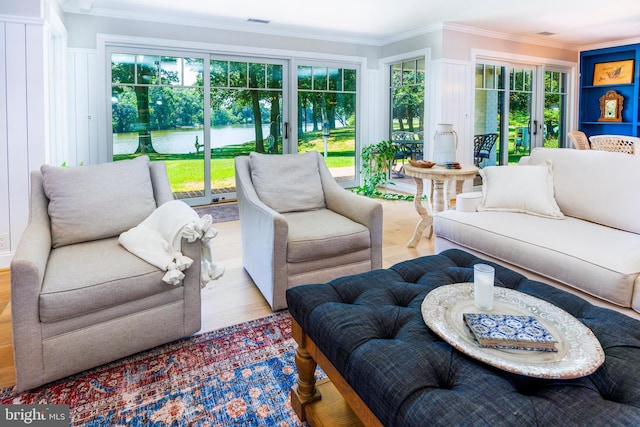 sunroom featuring french doors and visible vents