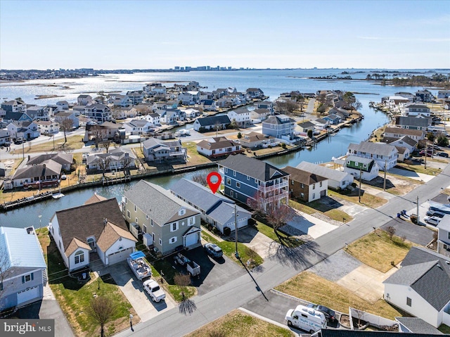 bird's eye view featuring a residential view and a water view