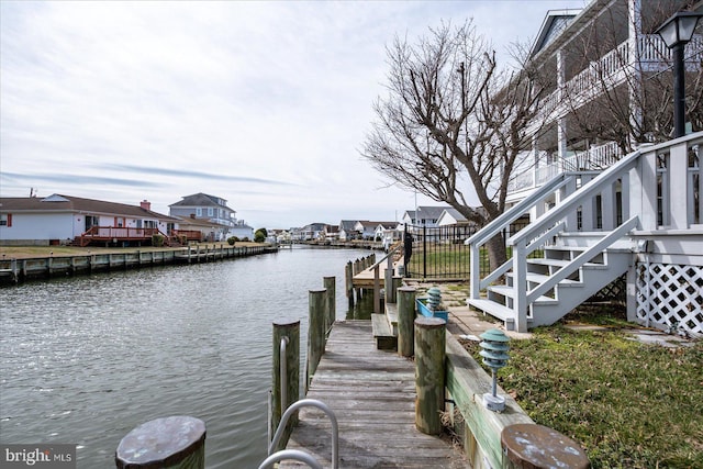 view of dock with a water view and stairs