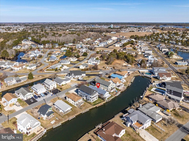 birds eye view of property featuring a residential view and a water view