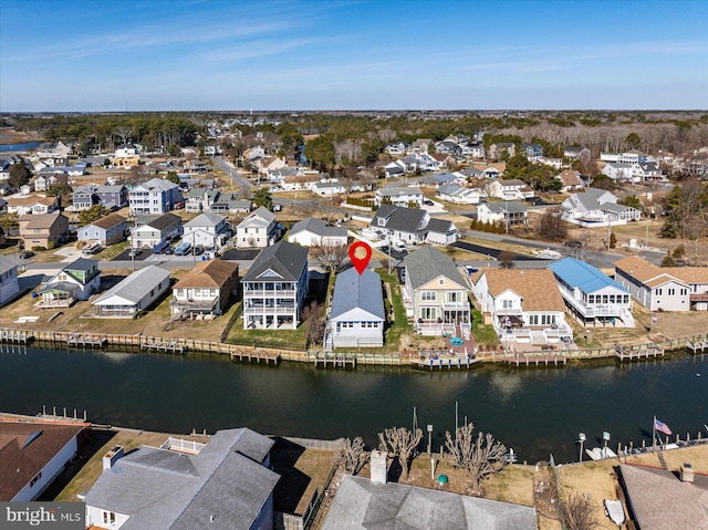 bird's eye view featuring a residential view and a water view