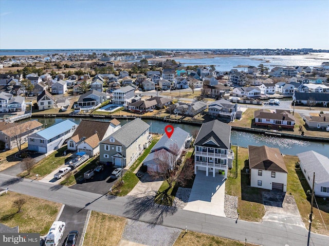 birds eye view of property featuring a residential view and a water view