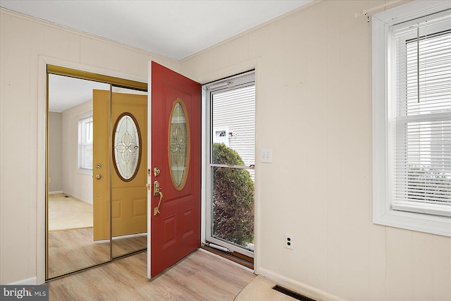 foyer featuring visible vents and light wood-type flooring