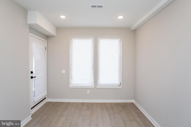 interior space featuring recessed lighting, visible vents, baseboards, and wood finished floors