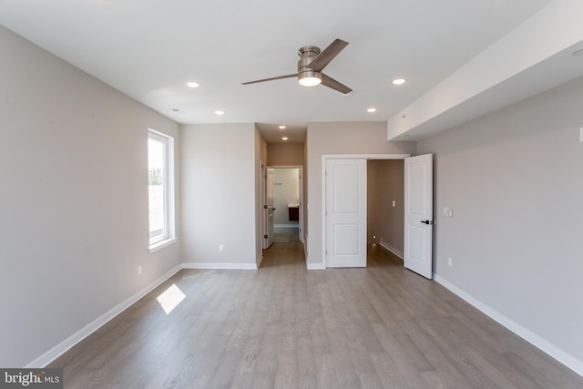 unfurnished bedroom featuring recessed lighting, visible vents, baseboards, and wood finished floors