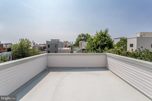 view of patio featuring a balcony