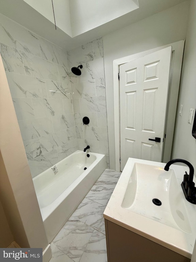 full bathroom featuring marble finish floor, shower / tub combination, and vanity