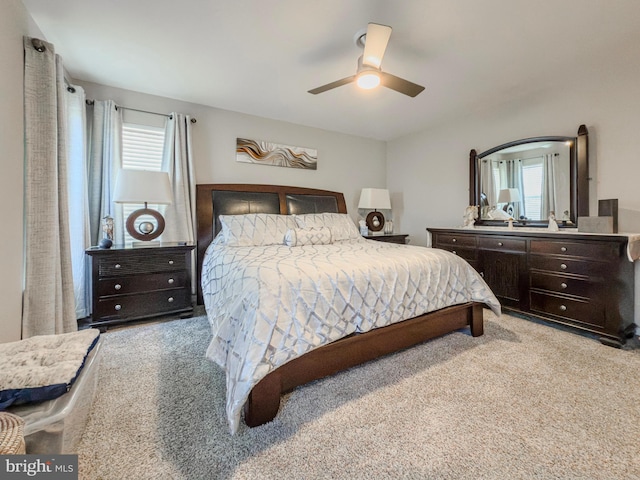 carpeted bedroom featuring a ceiling fan