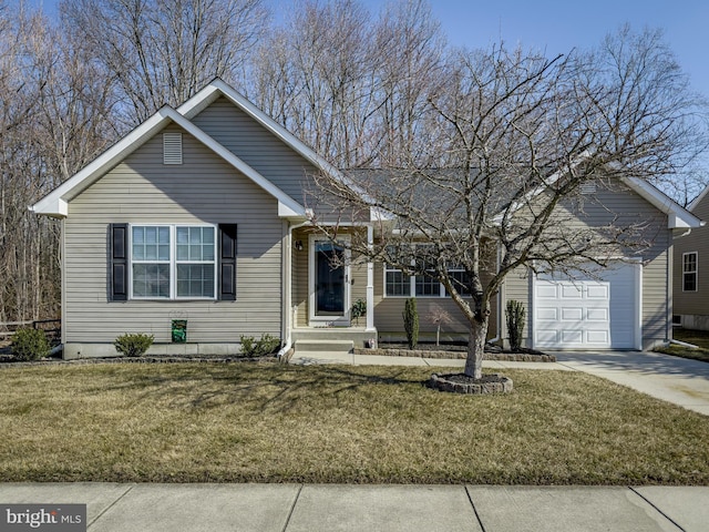 view of front of property featuring a garage, driveway, and a front lawn