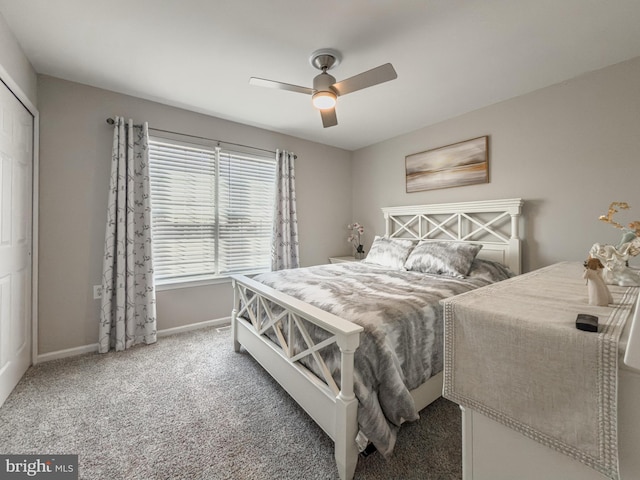 carpeted bedroom with baseboards and a ceiling fan