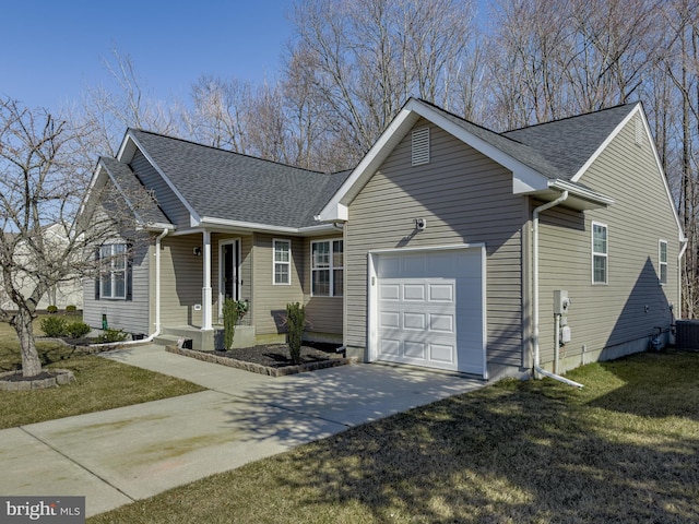 ranch-style house with a garage, driveway, a shingled roof, and a front lawn