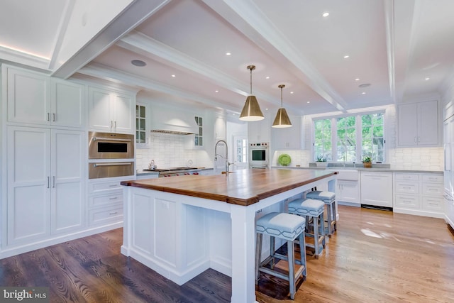 13401 Longnecker Rd, Reisterstown, MD 21136 - kitchen with beam ceiling, a warming drawer, wood counters, light wood-type flooring, and white appliances