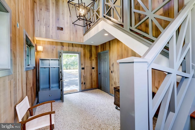 13401 Longnecker Rd, Reisterstown, MD 21136 - entryway featuring a notable chandelier, recessed lighting, visible vents, a towering ceiling, and wood walls