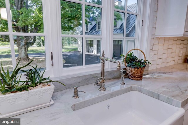 13401 Longnecker Rd, Reisterstown, MD 21136 - interior details featuring light stone countertops, white cabinets, and a sink