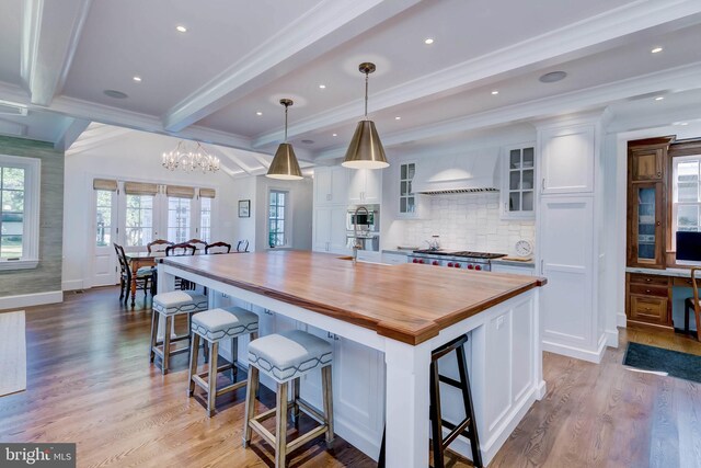 13401 Longnecker Rd, Reisterstown, MD 21136 - kitchen with light wood-style flooring, wood counters, and white cabinetry