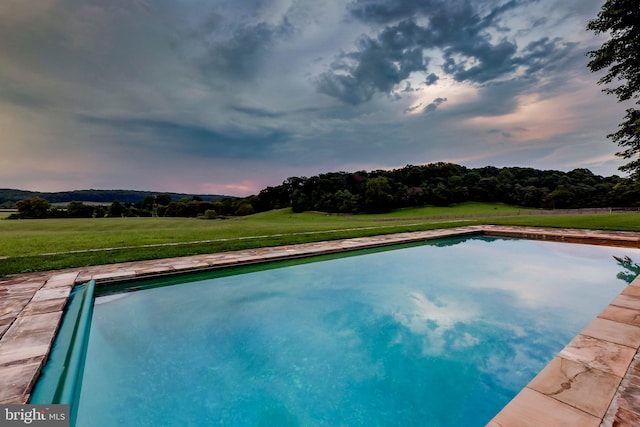 13401 Longnecker Rd, Reisterstown, MD 21136 - pool at dusk featuring a lawn