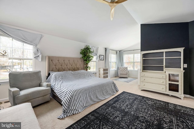 bedroom featuring carpet floors, baseboards, and vaulted ceiling