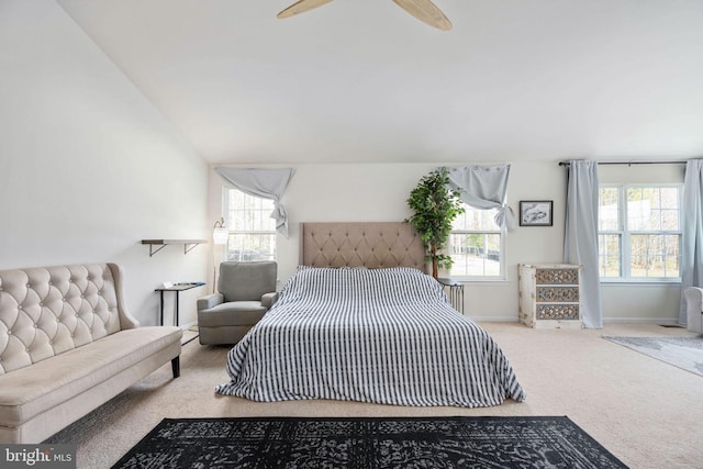 bedroom featuring ceiling fan, baseboards, lofted ceiling, and carpet floors